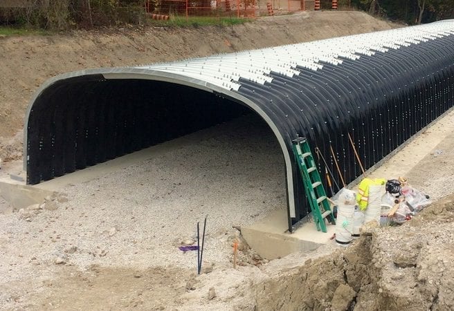 Corrugated steel box culvert value engineered with polymer coating on lower portion only