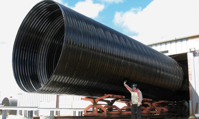 Polymer-laminated CMP corrugated metal pipe