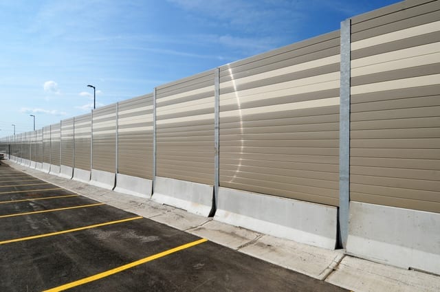 Structure-mounted-sound-wall-on-Jersey-barriers