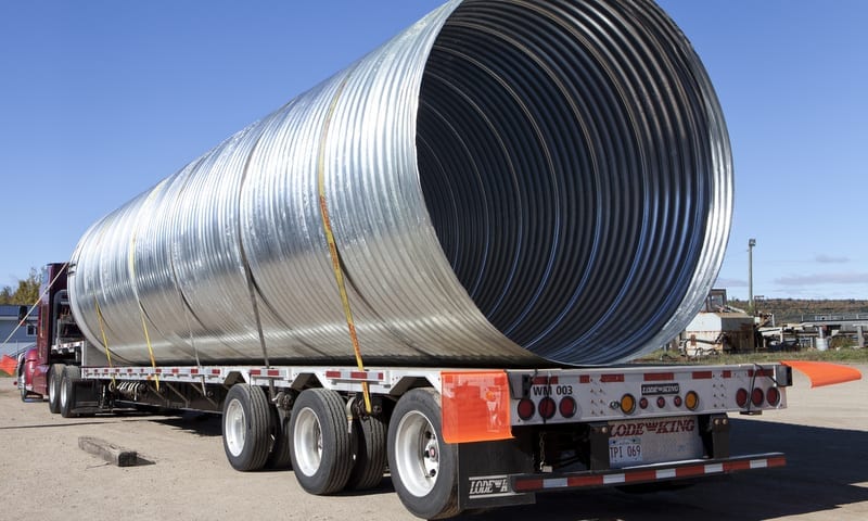 corrugated steel pipe on flatbed