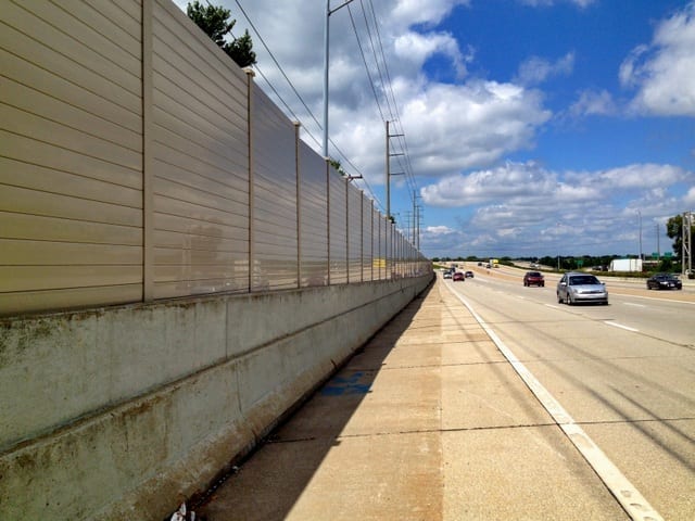 Structure-mounted-noise-barrier-along-highway