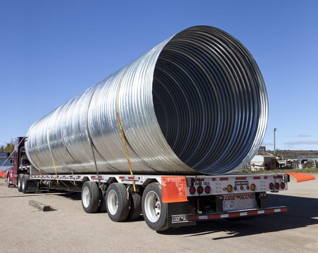 corrugated steel pipe on flatbed