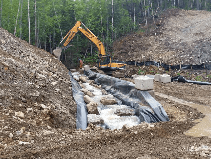 Temporary creek by-pass flume from site access road