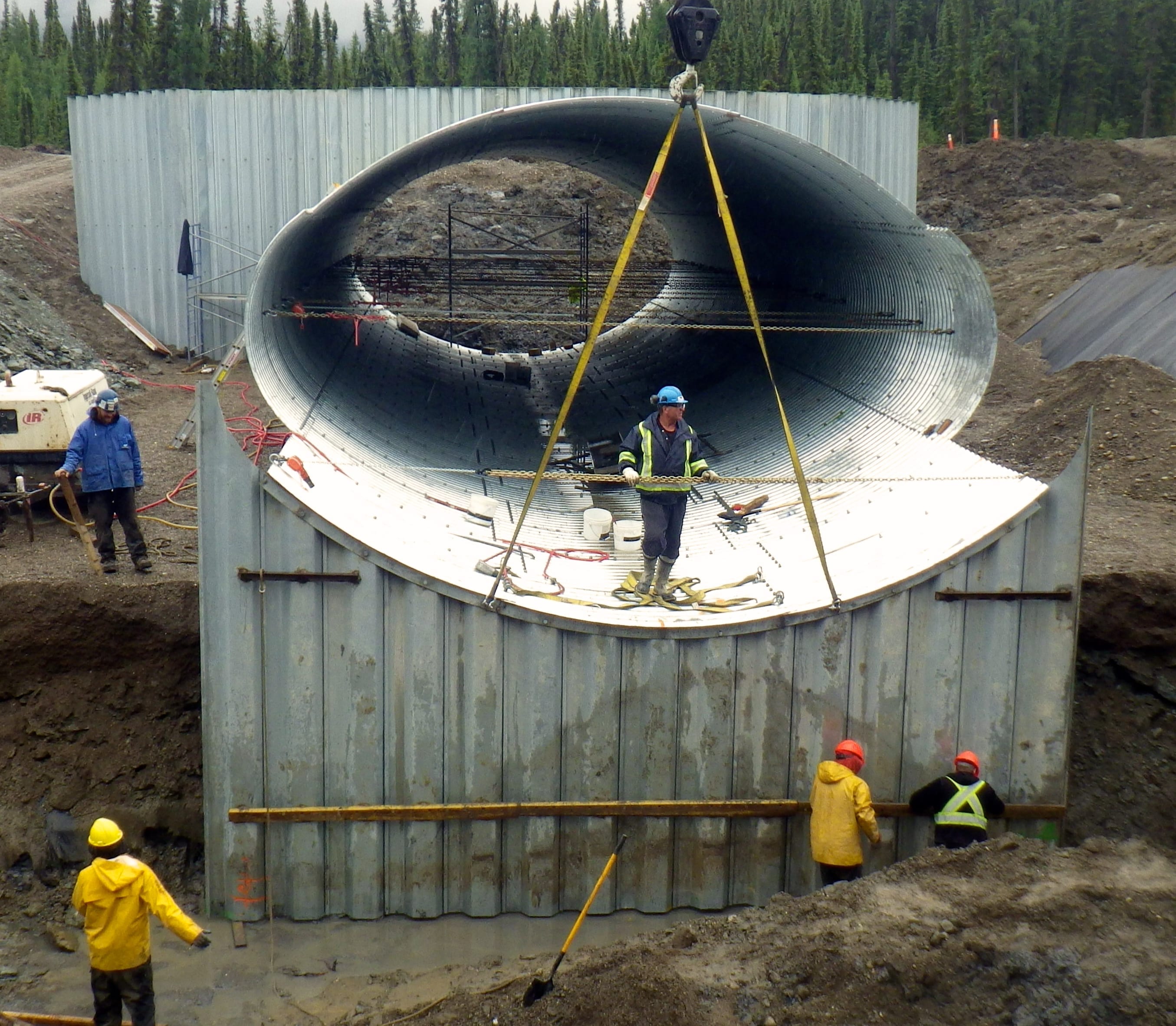 Assembly of Bolt-A-Plate culvert with Steel Sheet Piling end walls