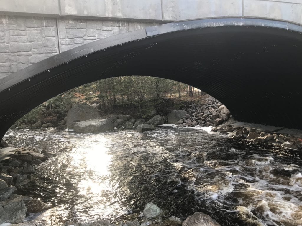 Buried arch bridge offers open hydraulic flow