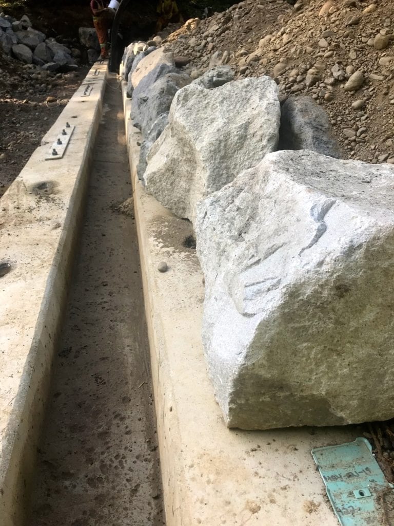 Detail view of precast footings with scour protection rocks