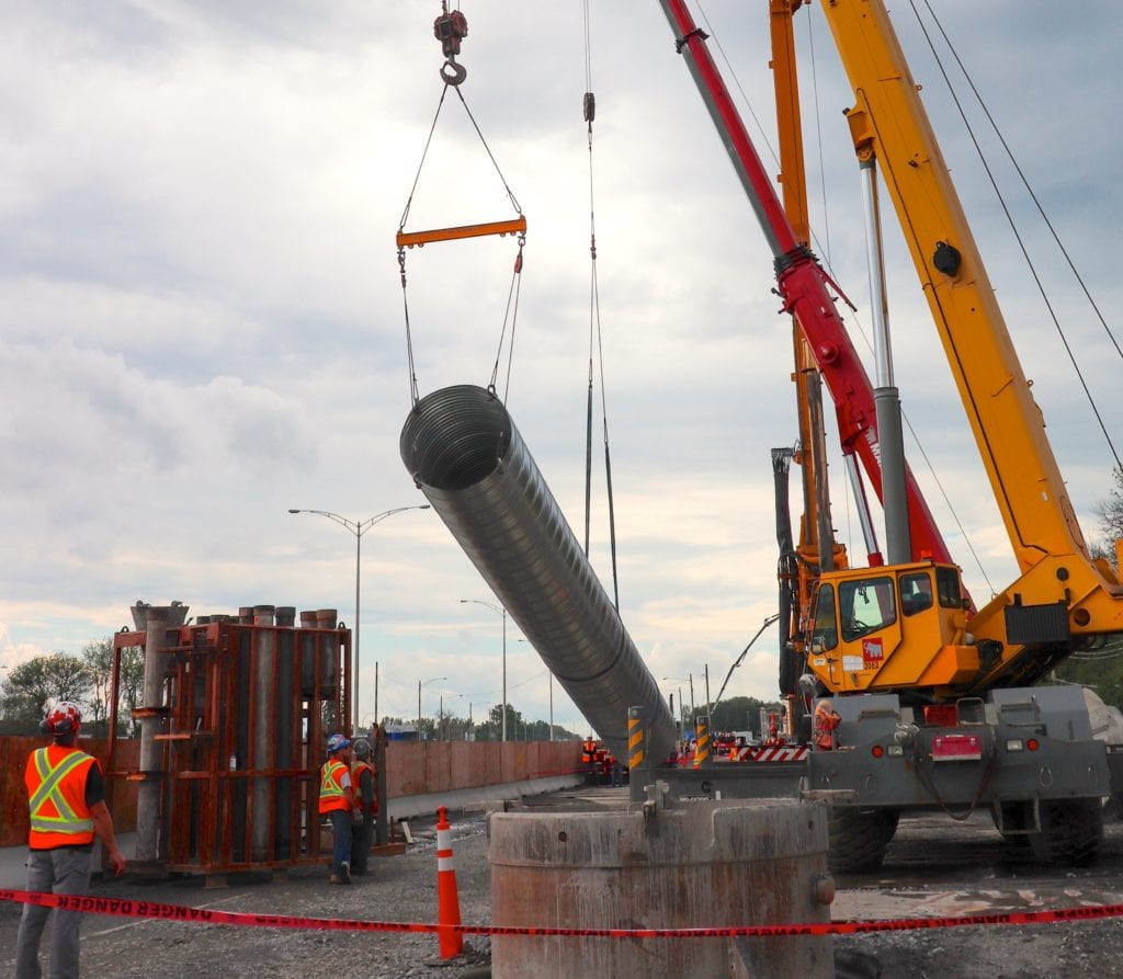 Corrugated Steel Pipe being crane lifted