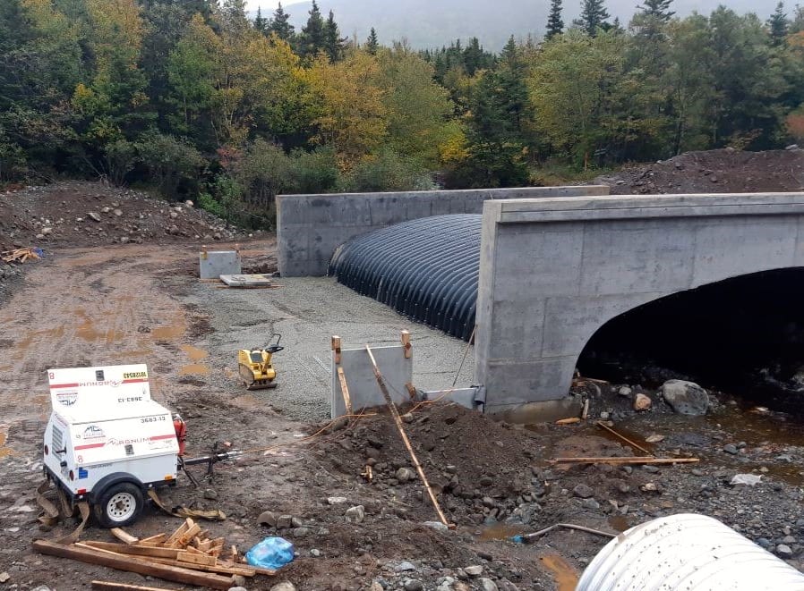 Wingwalls and backfilling begins on box culvert