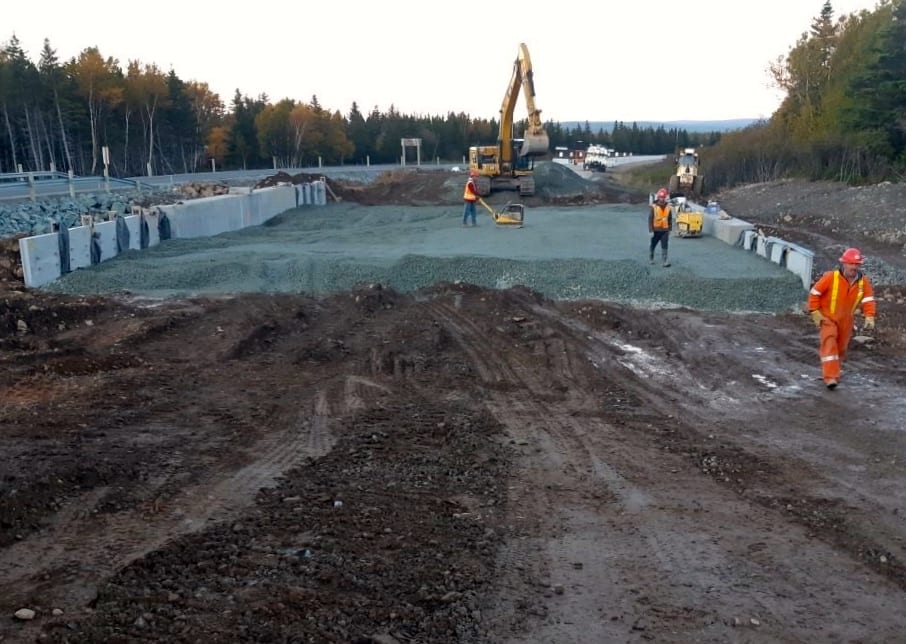 Backfilling nears completion on buried metal bridge