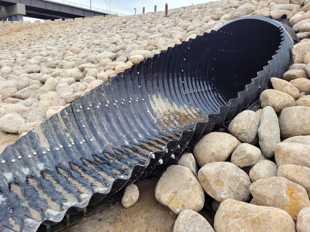 Polymer-Coated Bolt-A-Plate culvert in sloped rock embankment