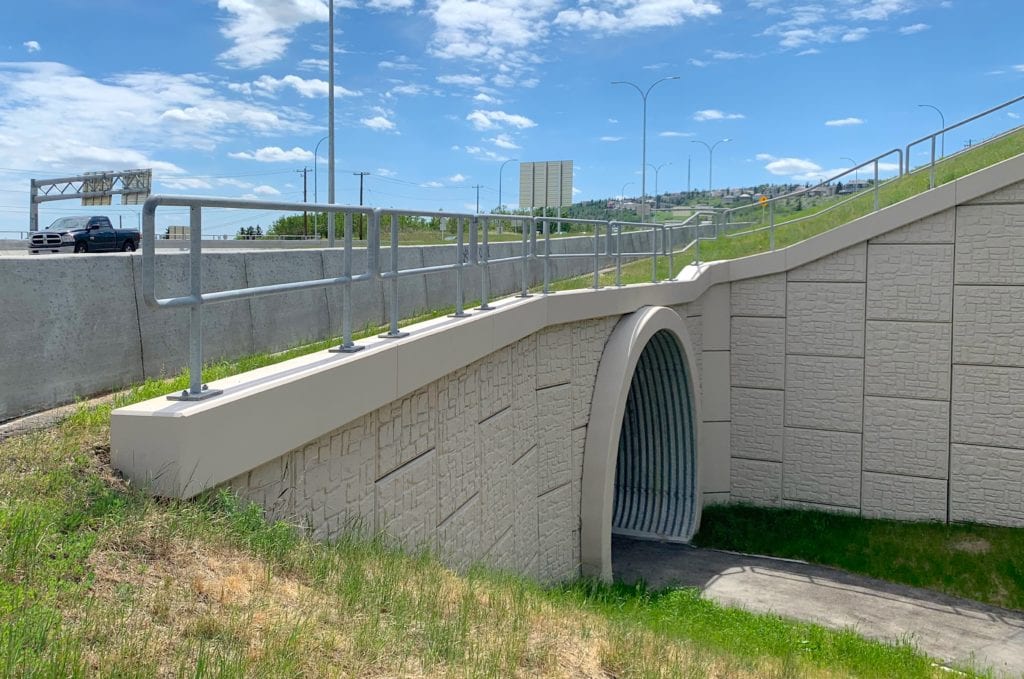 Street-level view of buried metal pedestrian tunnel