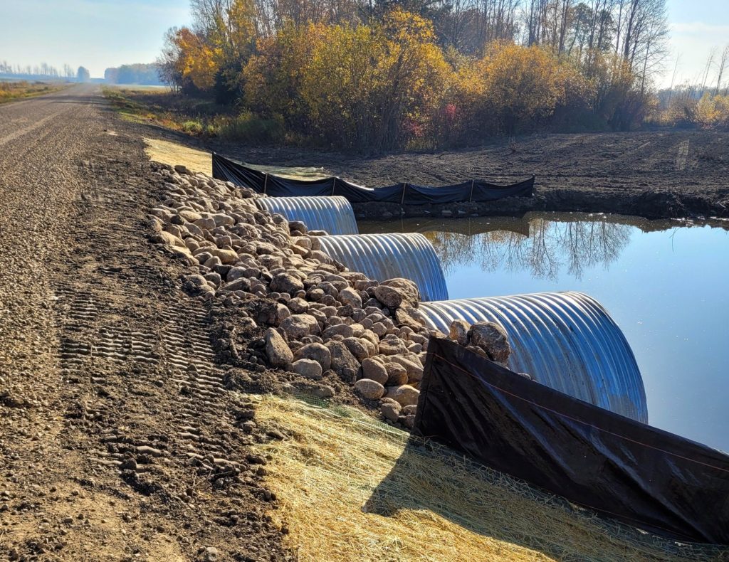 Top view of three Corrugated Steel Pipes installed under a rural road