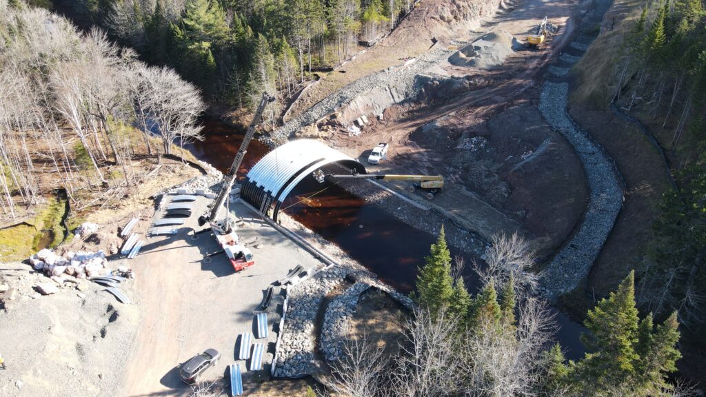 Distant aerial view of Ultra-Cor Buried Metal Bridge under construction