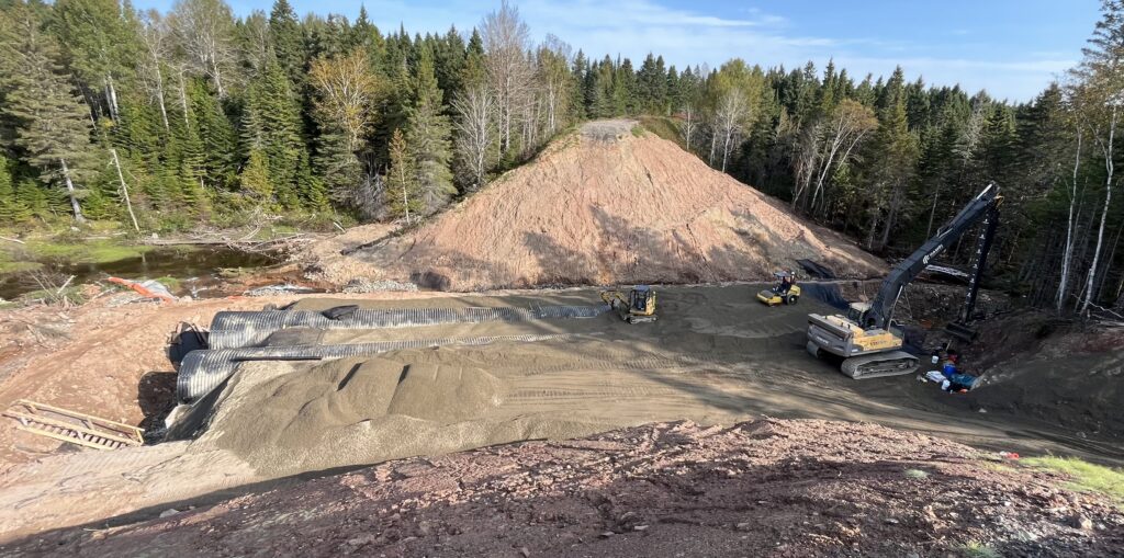 Wide view of twin Bolt-A-Plate culvert engineered backfill