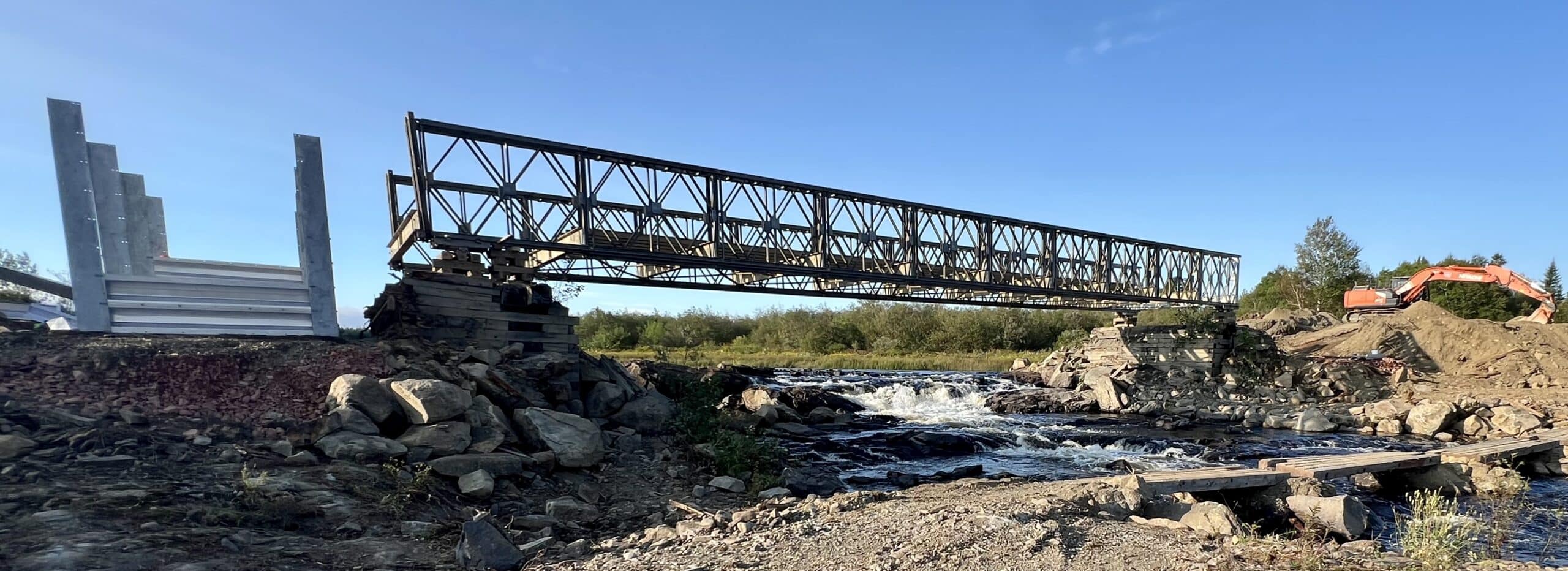 Wide view of lifted modular panel bridge