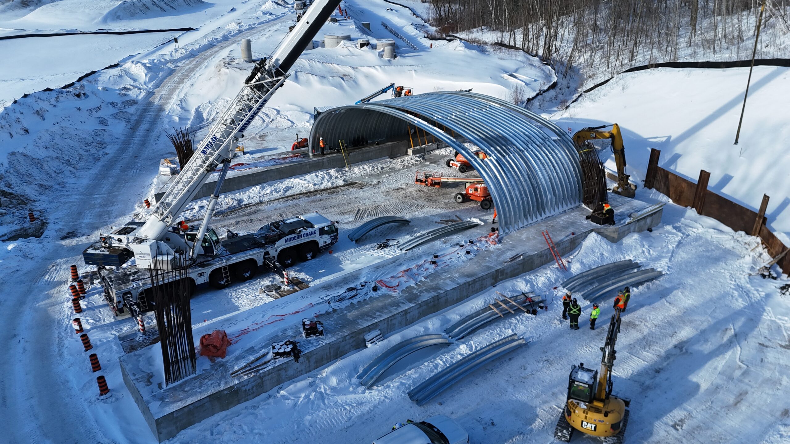 Aerial view of assembly of AIL Ultra-Cor Structural Steel Plate in winter