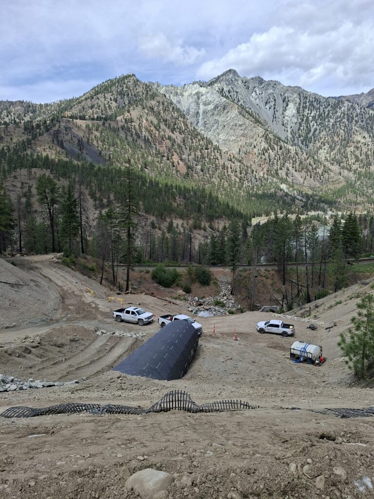 Aerial view of oversized AIL-Bolt-A-Plate Structural Steel Plate Round installed under deep cover
